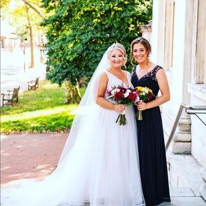 Black bridesmaid dress worn once with pockets! Lace top chiffon flowy bottom.